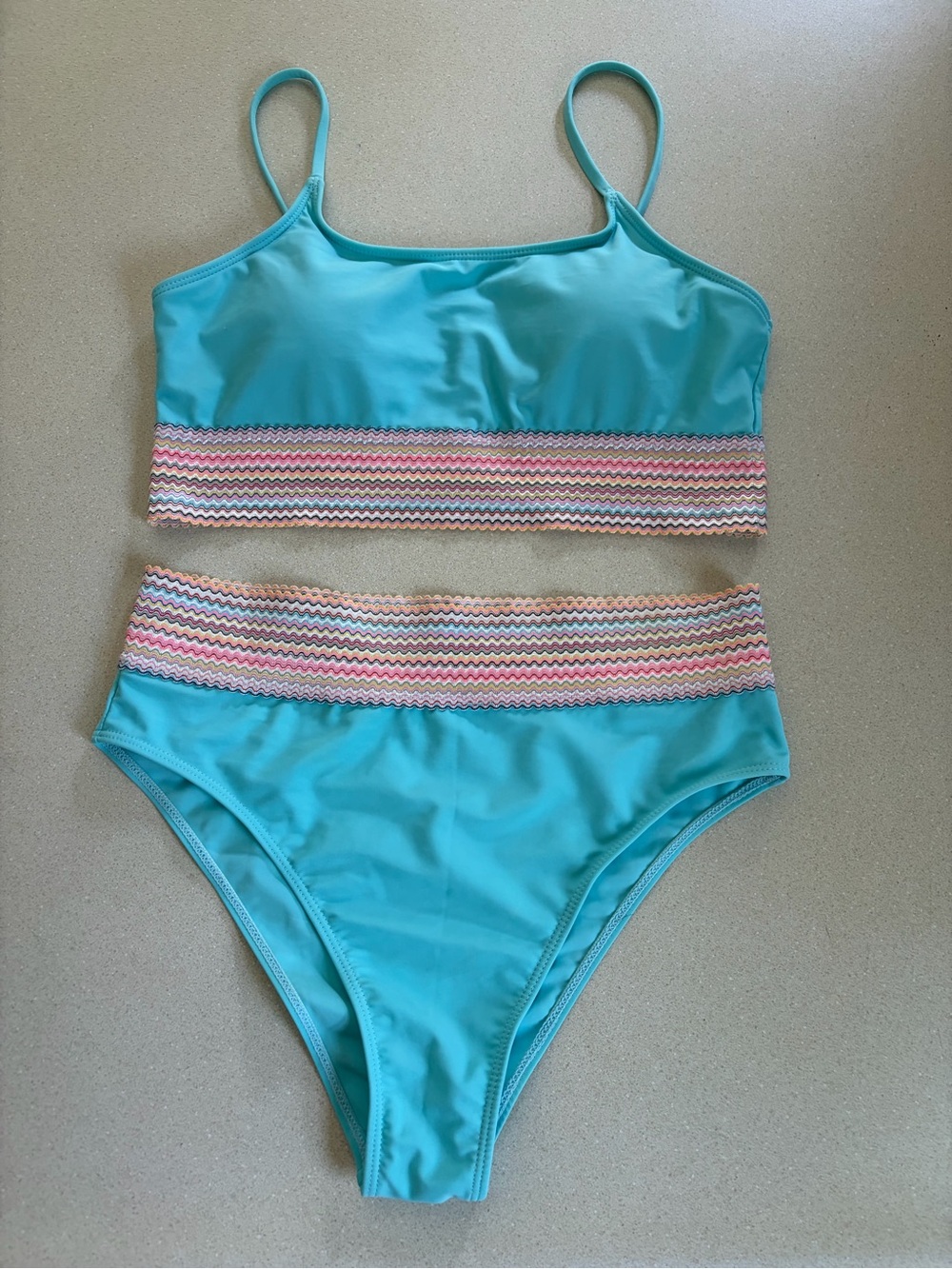 Turquoise Two-Piece Swim Set with multi color Chevron Trim. Worn once
